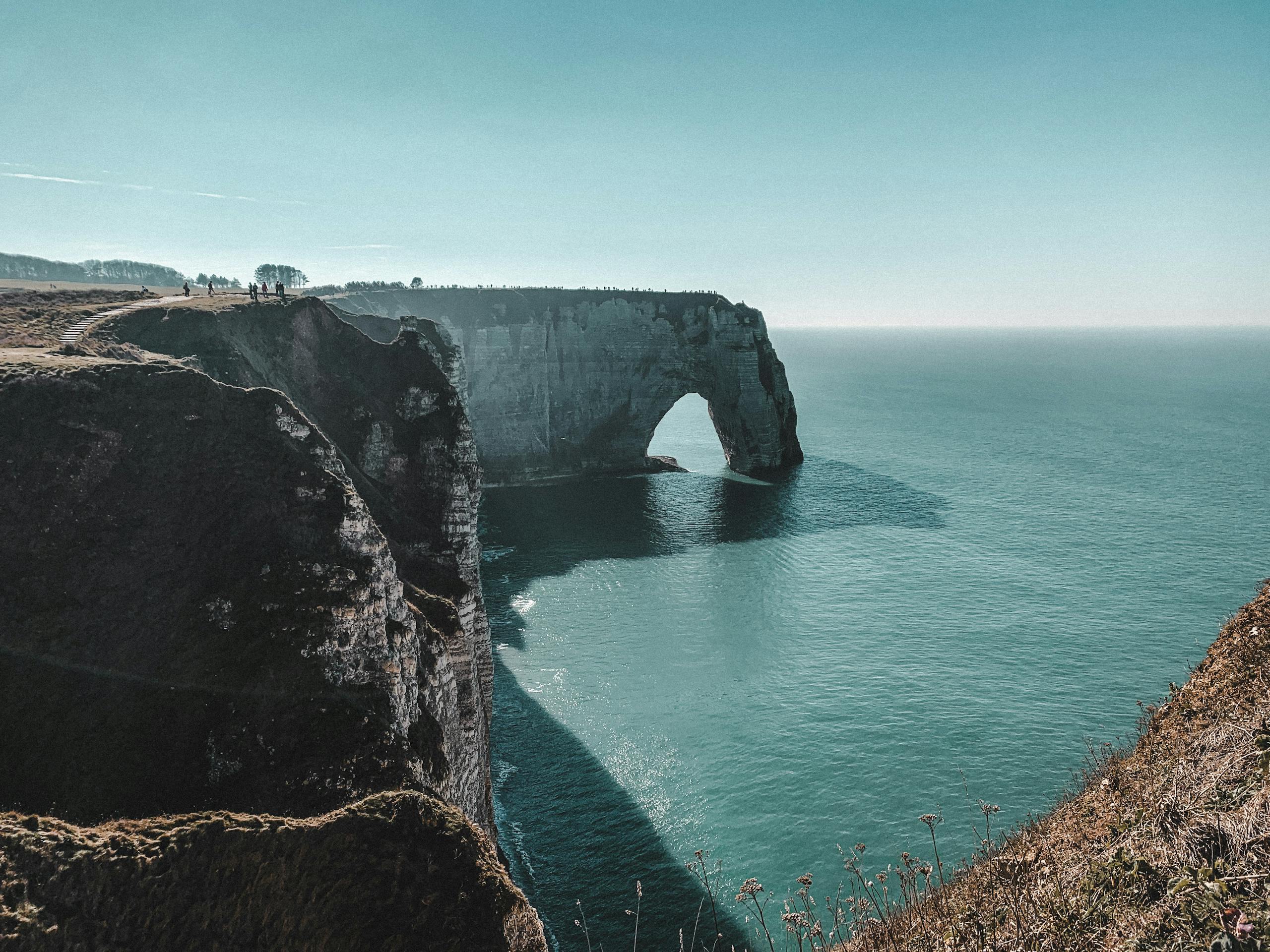 Breathtaking view of iconic cliffs and sea at Étretat, France showcasing natural beauty.