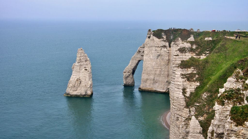 Breathtaking view of the iconic limestone cliffs at Étretat, Normandy, France.